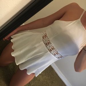 White romper with floral detailing